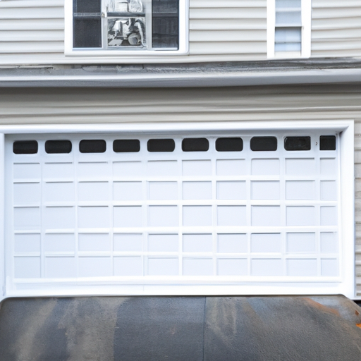 Insulated sectional garage door on a Marblehead, MA residence in soft morning light.