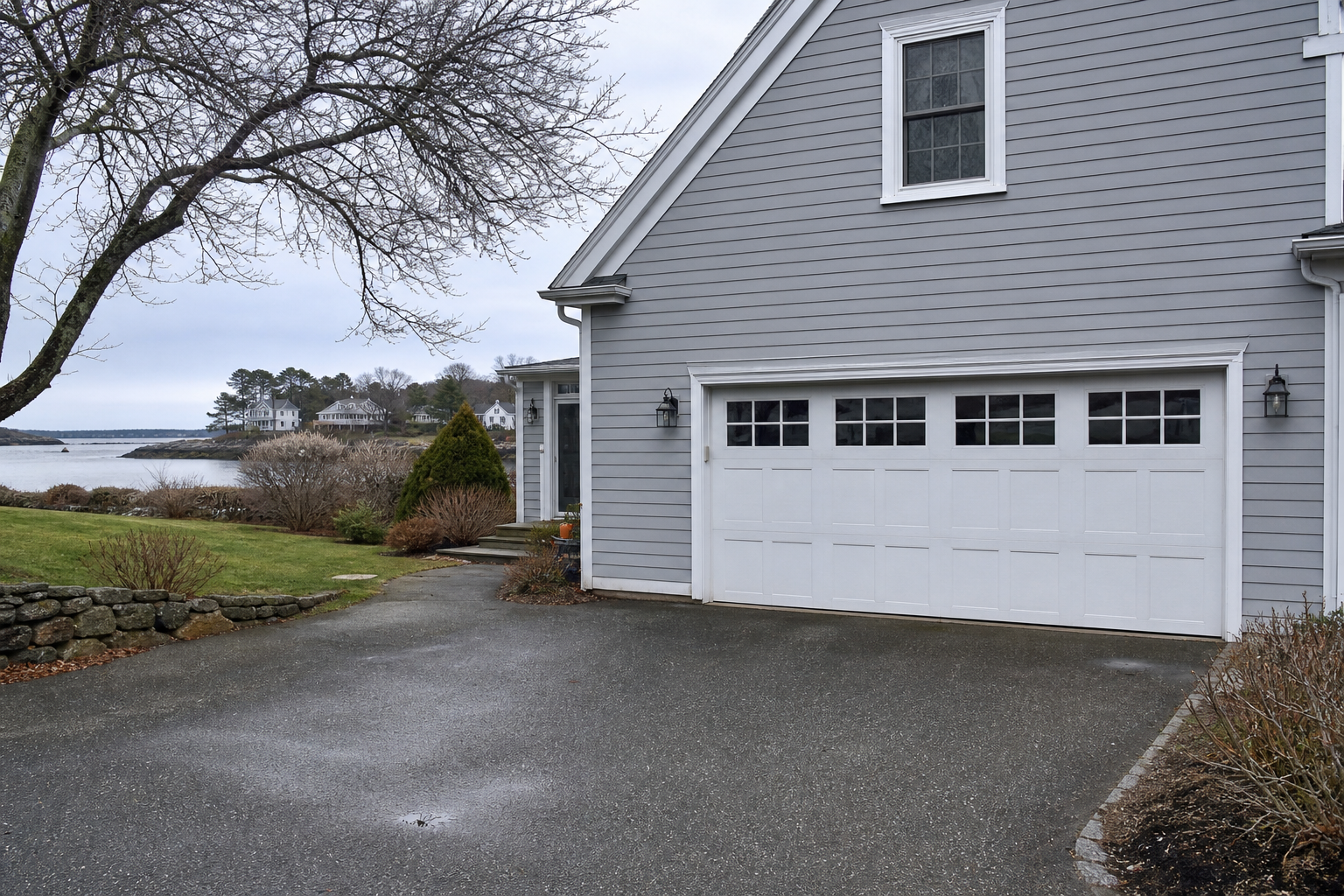 Garage door on a Marblehead home driveway in natural coastal light